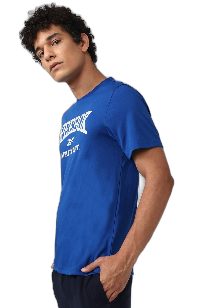 REMERA RBK Fitness WOR Poly Graphic SS